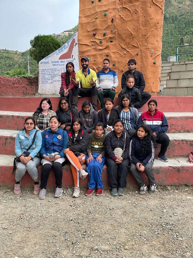 Team CABD sitting in front of an artificial wall